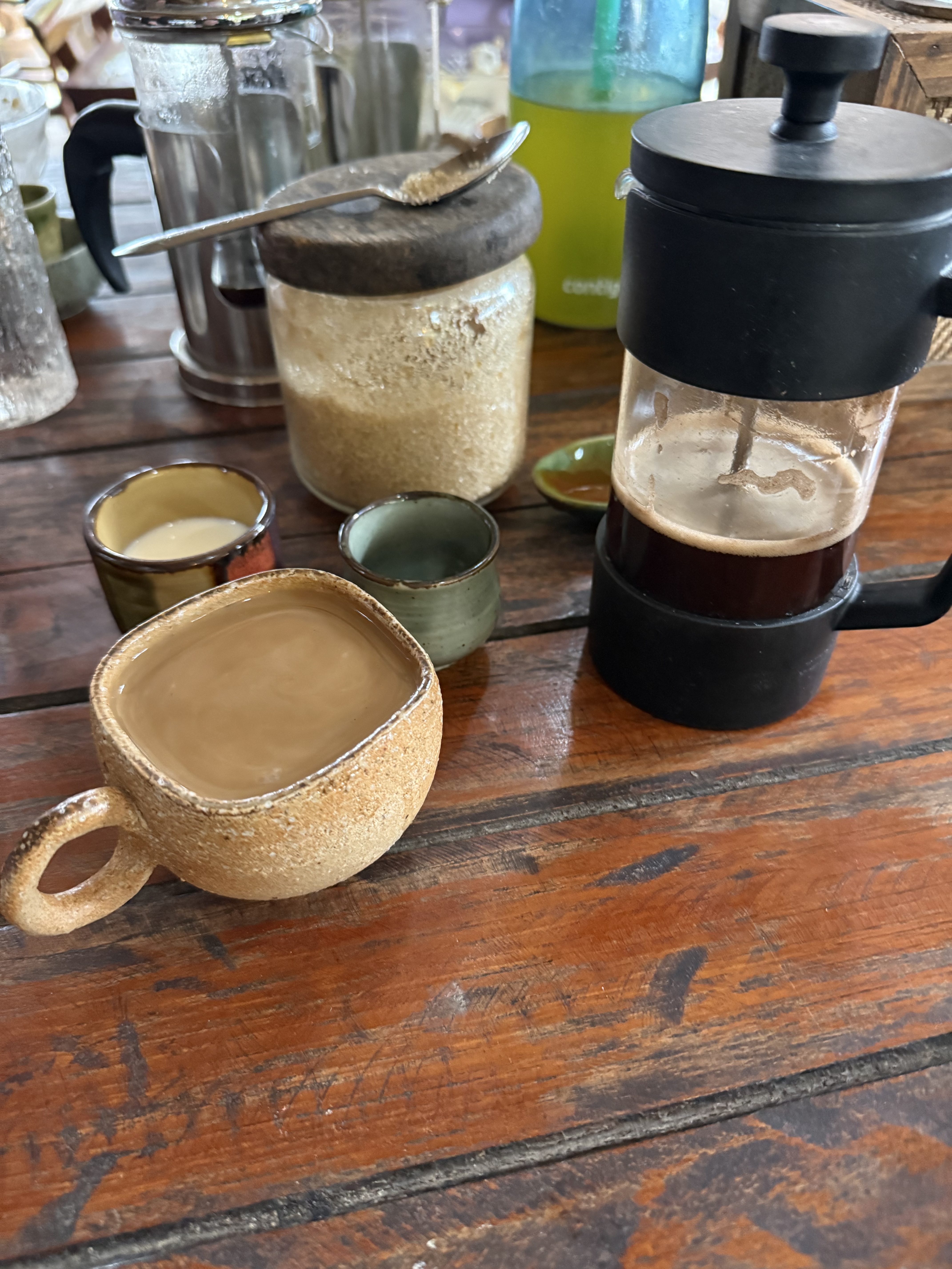 Handmade cups and a French press at Borderline Coffee